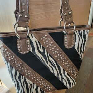 Stylish Zebra Print Tote Bag with Brown Accents Calf Hair Metal Feet. Leather.